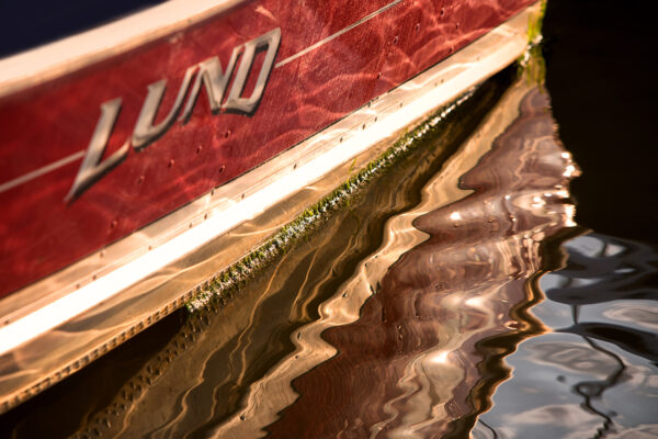 water lapping against the side of a boat docked in Essex Marina